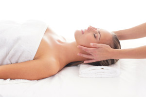 Young attractive woman getting spa treatment over white background